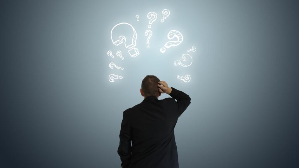 Confused business owner facing financial uncertainty and decision challenges.